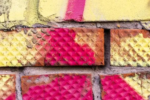 Graffiti painted on a brick wall texture. Stock Photos