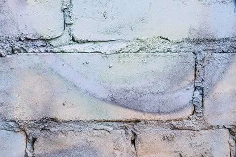 Graffiti painted on a brick wall texture. Stock Photos