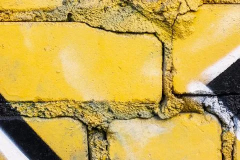 Graffiti painted on a brick wall texture. Stock Photos
