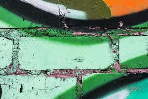 Graffiti painted on a brick wall texture. Stock Photos