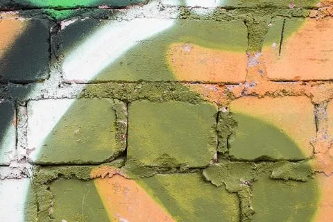 Graffiti painted on a brick wall texture. Stock Photos