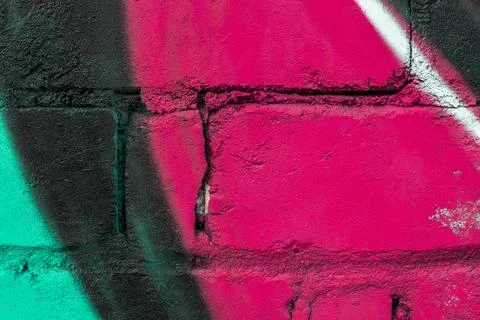 Graffiti painted on a brick wall texture. Stock Photos