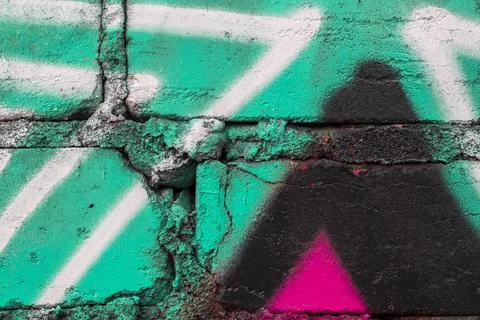 Graffiti painted on a brick wall texture. Stock Photos