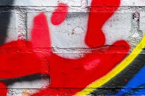 Graffiti painted on a brick wall texture. Stock Photos