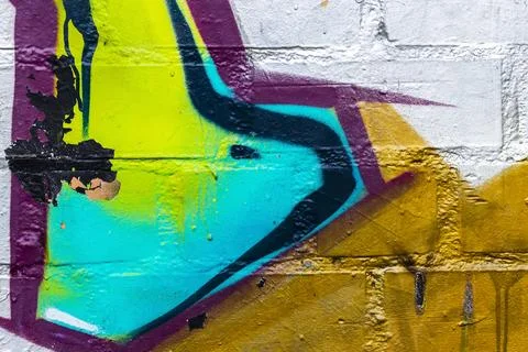 Graffiti painted on a brick wall texture. Stock Photos