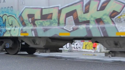 GRAFFITI ON A PASSING TRAIN IN THE CITY. Stock Footage 81645865