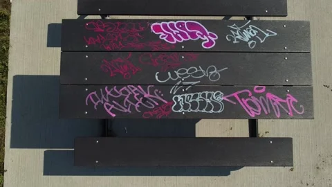 Graffiti on picnic table Stock Footage