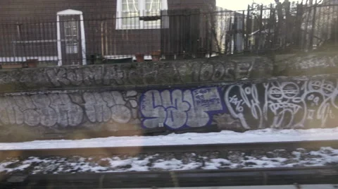 Graffiti piece view from moving B train subway in Brooklyn winter snow NYC 스톡 동영상 59864938