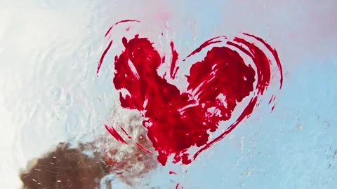 The graffiti, a red heart on a transparent surface, is erased by the cleaning Stock Footage 315355577
