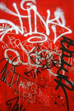 Graffiti on red, vertical Foto stock