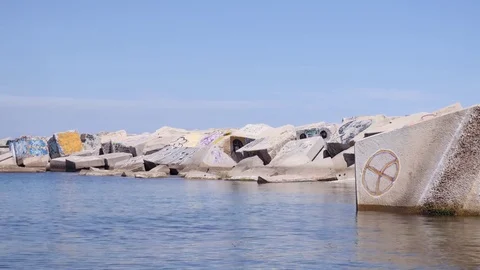 Graffiti on rocks in the sea Stock Footage 75689860