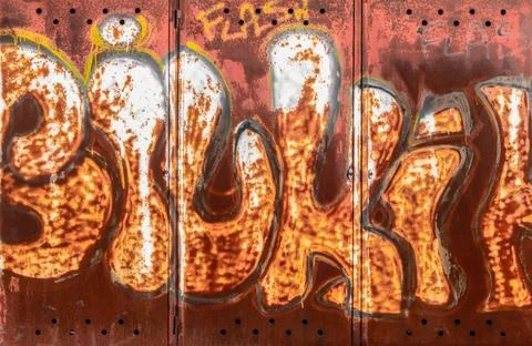 Graffiti on rusty metal surface Graffiti on rusty metal surface. Ideal for... Stock Photos