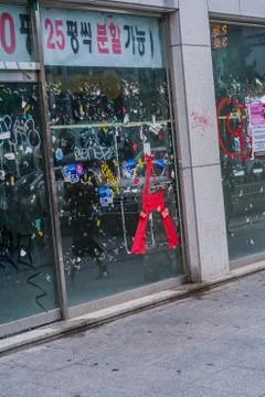 Graffiti scribbled across store windows Stock Photos