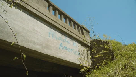 Graffiti on the side of a bridge that says Made in America Stock Footage 130910235