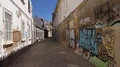 Graffiti in small old town city alley at facade in Faro at Algarve, Portugal 4k or 4k+ Resolution