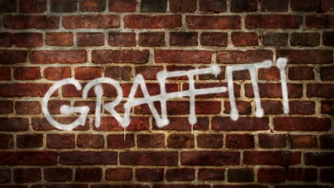 Graffiti spray painted on the brick wall Stock Footage 154644245