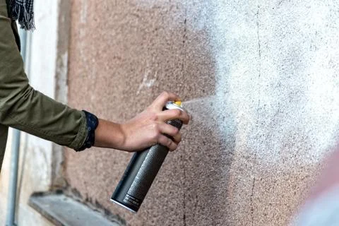 Graffiti is sprayed against the wall Stock Photos