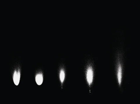 Graffiti sprayed light effects in pink over black Stock Illustration