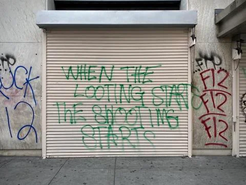 Graffiti sprayed on store shutters after political protests in Downtown LA Stock Photos