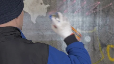 Graffiti. Teens paint on the wall. Stock Footage 83161855