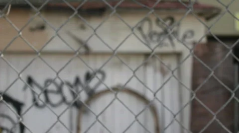 Graffiti through fence Stock Footage 739734