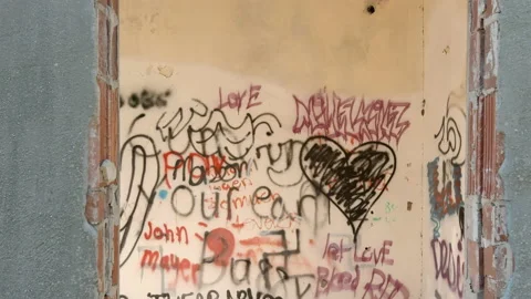 Graffiti through the window of an abandoned building. Stock Footage 166070692