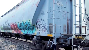 Graffiti Train pan to street Video stock 85494824