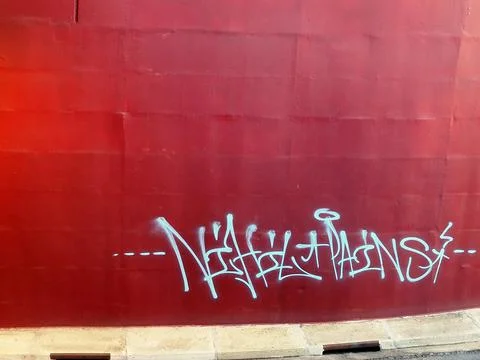 Graffiti on an underpass, on a wild-cherry background colour Stock-Fotos