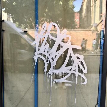 Graffiti vandalized window Stock Photos