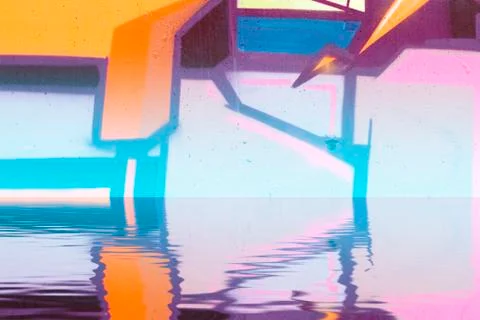 Graffiti wall background reflection in  water, artistic urban picture Illustrazione stock