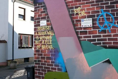 A graffiti wall with painted bricks Stock Photos