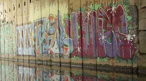 Graffiti  on wall. Reflection of graffiti in the water. Video stock 42681177