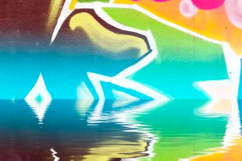 Graffiti wall texture reflection in  water, artistic urban picture Illustrazione stock