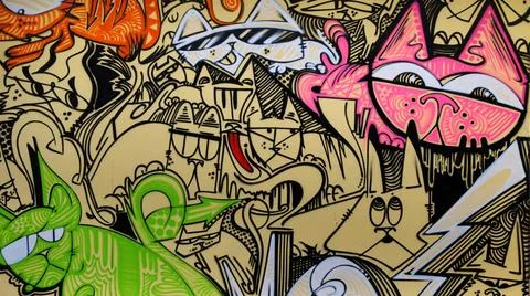 Graffito Buntes Graffito an einer Hauswand. Querformat. Colorful graffito ... Stock Photos