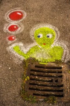 Graffitti down the drain Stock-Fotos