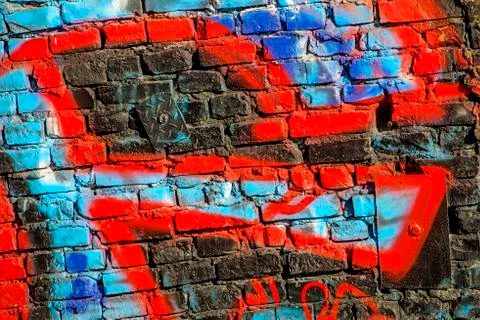 Graffitti on an old brick wall Stock Photos