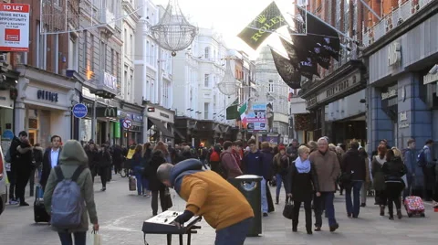 Grafton Street musician rocking Dublin shoppers Stock Footage
