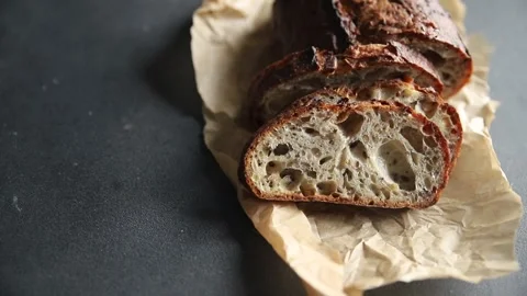 Grain bread oats sunflower, chia, flax seed, cut fresh tasty food dish Vidéo 303006367