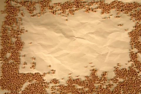 Grain on brown paper background Stock Photos