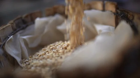 Grain drops into the basket, slow motion Stock Footage 124421561