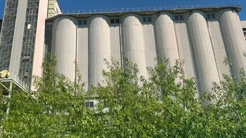 Grain elevator against a blue sky. Stock Footage 278159232