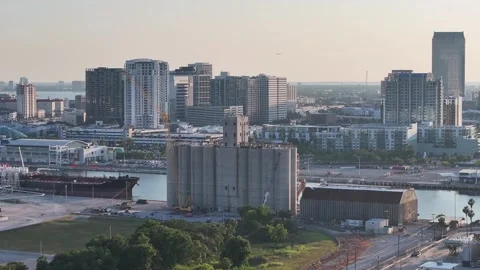 Grain elevator and bulk carrier at the Tampa port channel Stock Footage 309061831
