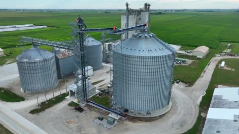 Grain elevator and ethanol plant in Midwest USA. Aerial orbit in summer. Stock Footage 249731081