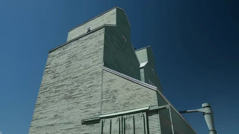 Grain elevator with blue sky Stock Footage 80400116