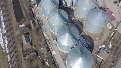 Grain elevator business with large storage bins of corn, grain Stock Footage 153542510