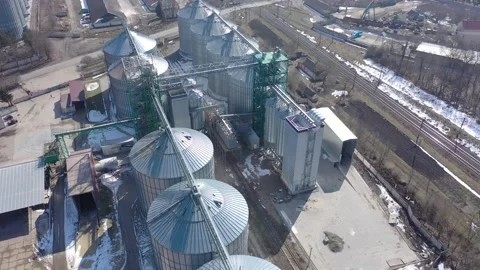 Grain elevator business with large storage bins of corn, grain Stock Footage 153542563