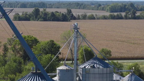 Grain Elevator Complex Framed by Patterned Farmland Stock Footage 323875541