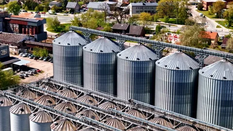 Grain elevator facility cereal storage agriculture harvest conservation, aerial Stock Footage 308766172