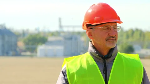 Grain elevator industry man walks at construction site Stock Footage 169880840