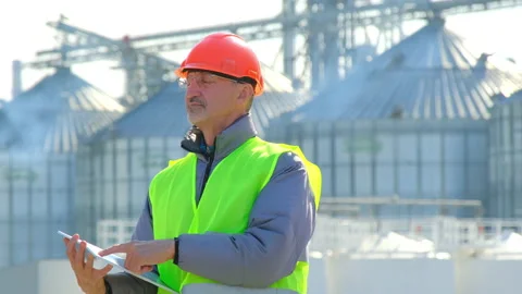 Grain elevator marine shipping taskmaster inspects new silo Stock Footage 165543292
